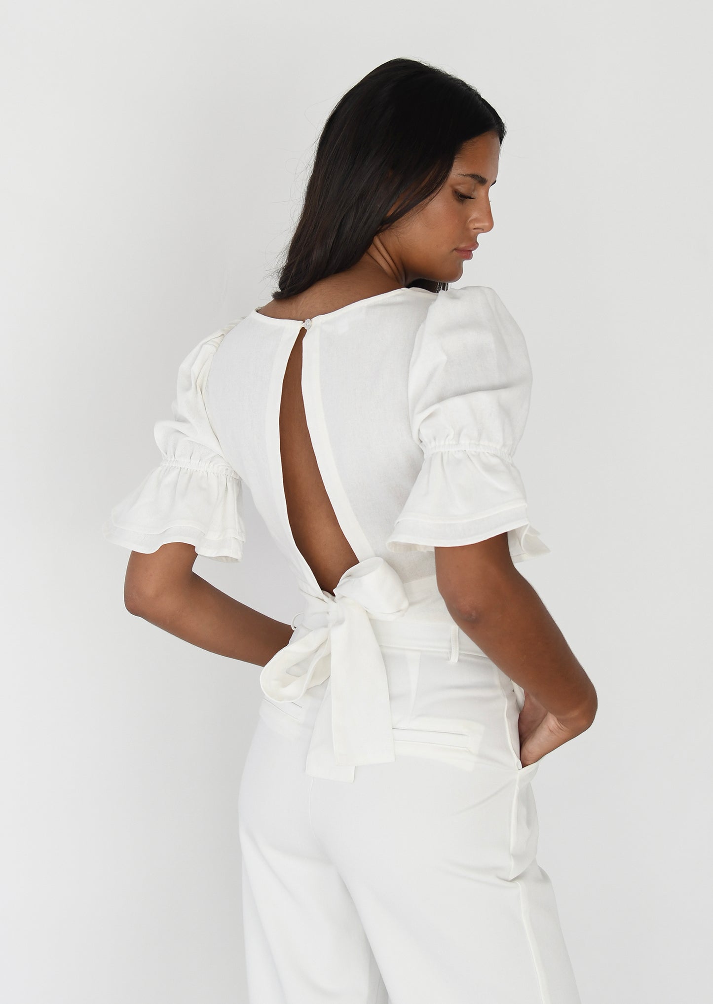 Top de lino manga abullonada