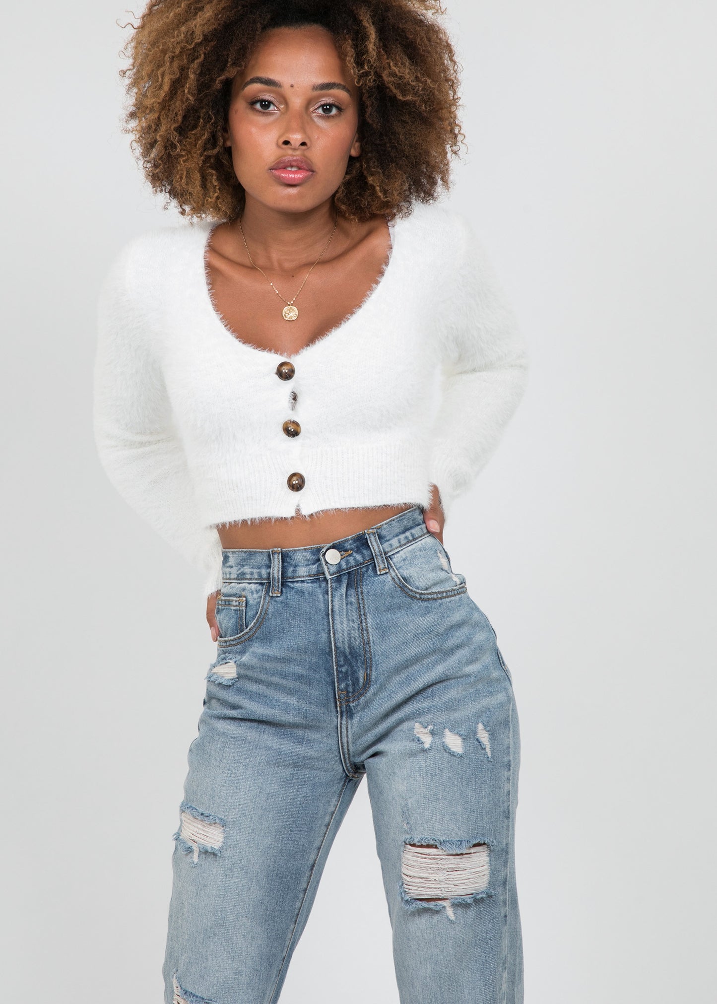 Split hem jean in with rips in blue