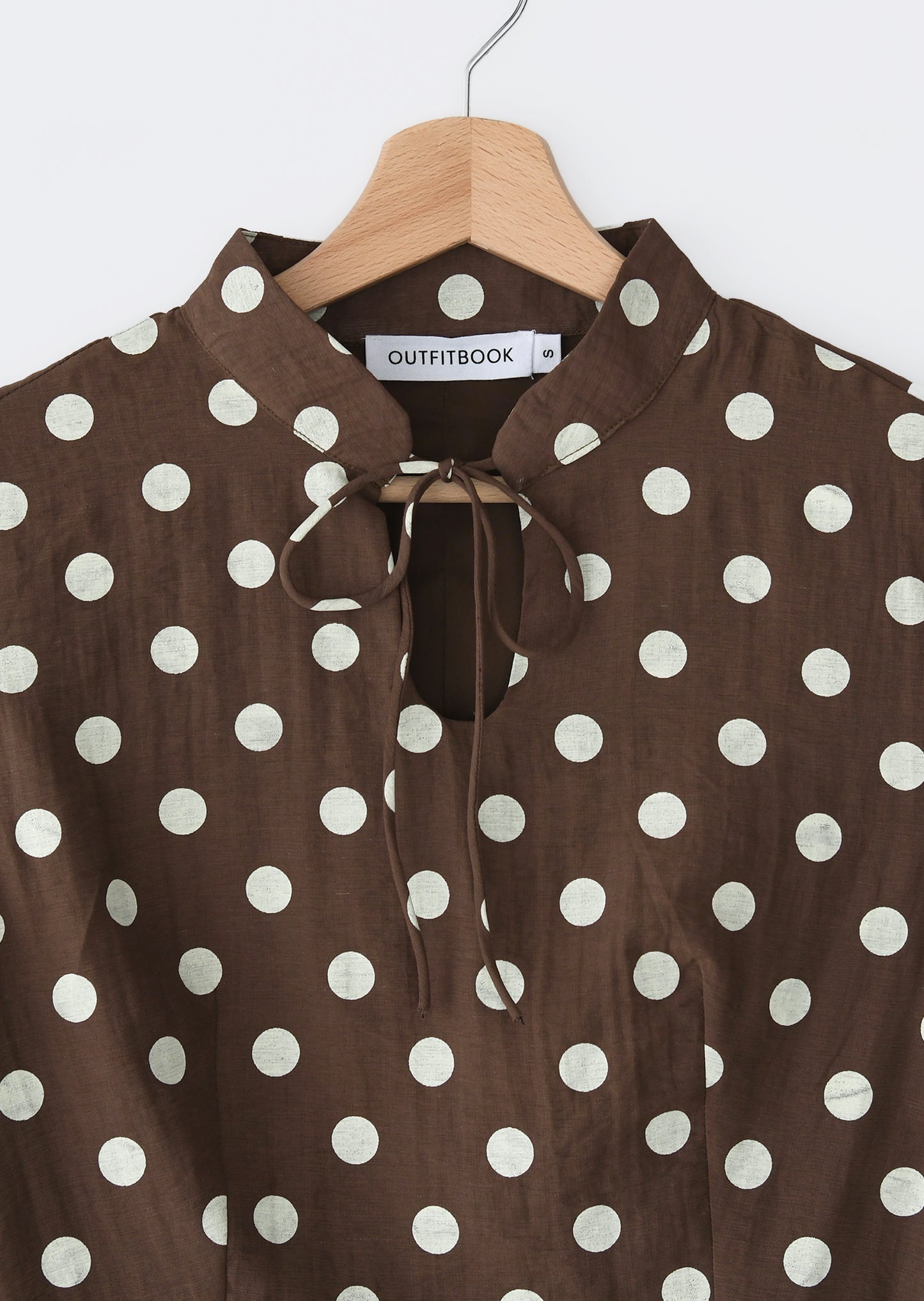 Top avec col à nouer à pois
