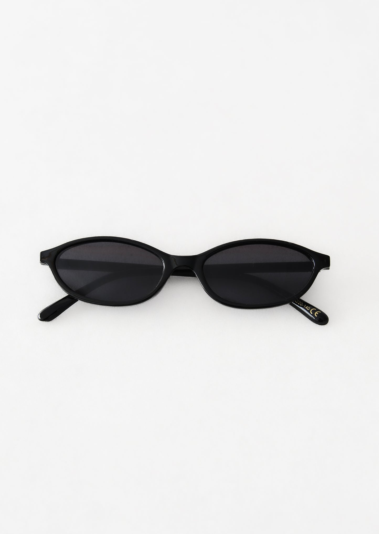 Skinny oval sunglasses in black 