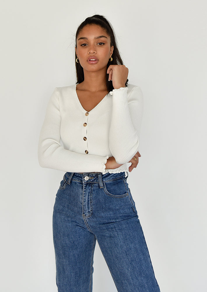 Ruffle hem button front ribbed cardigan in white