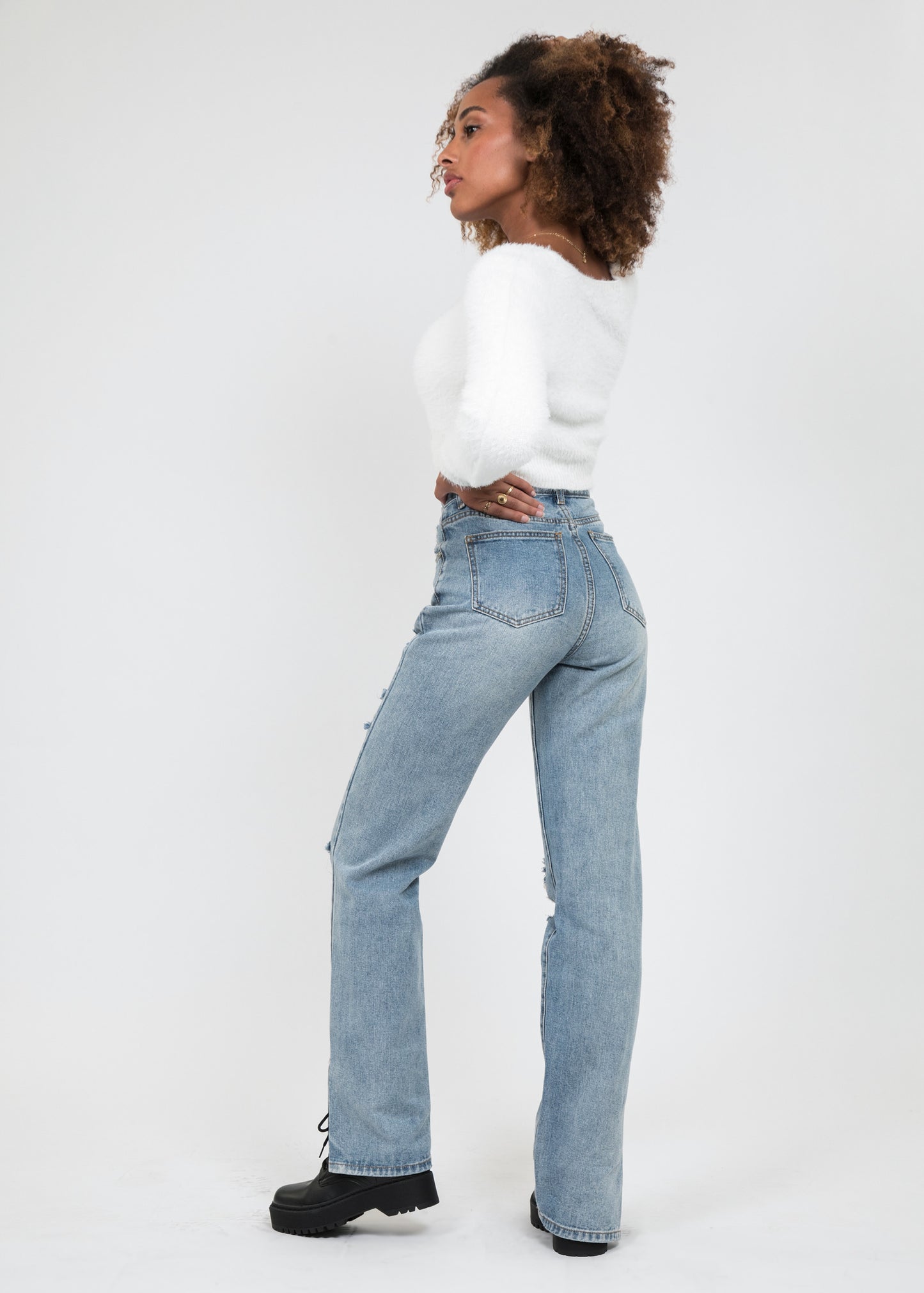 Split hem jean in with rips in blue