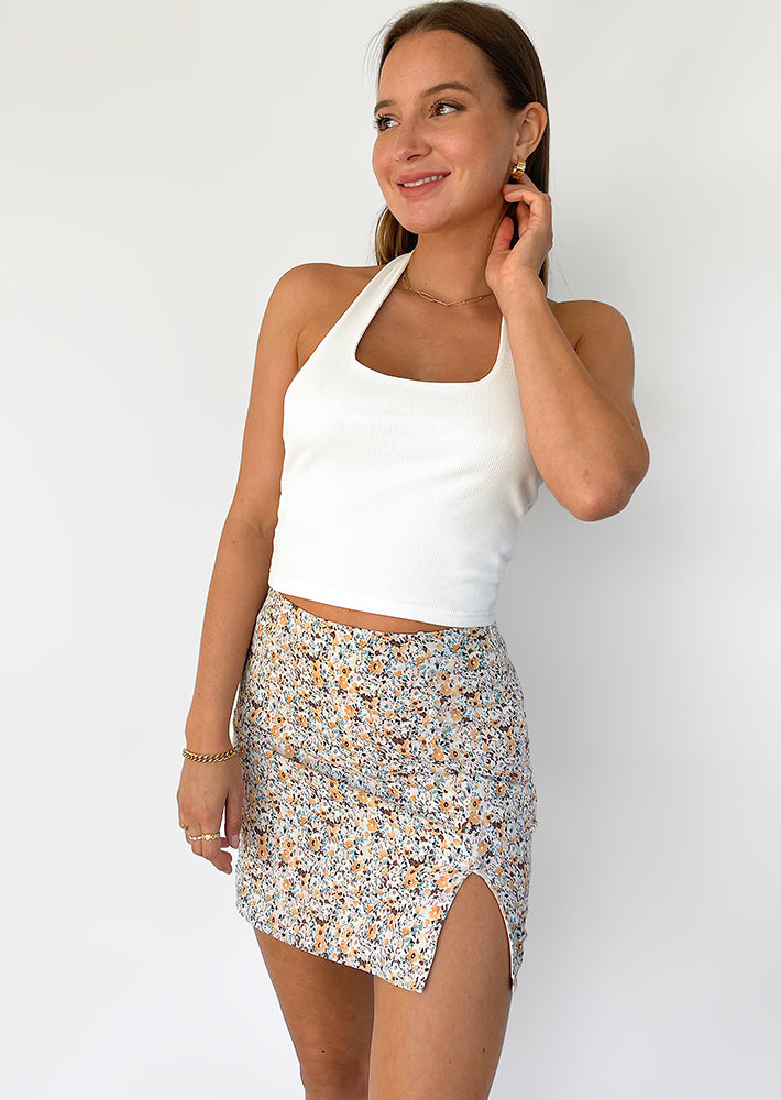 Floral mini skirt with front split and buttons details in multi