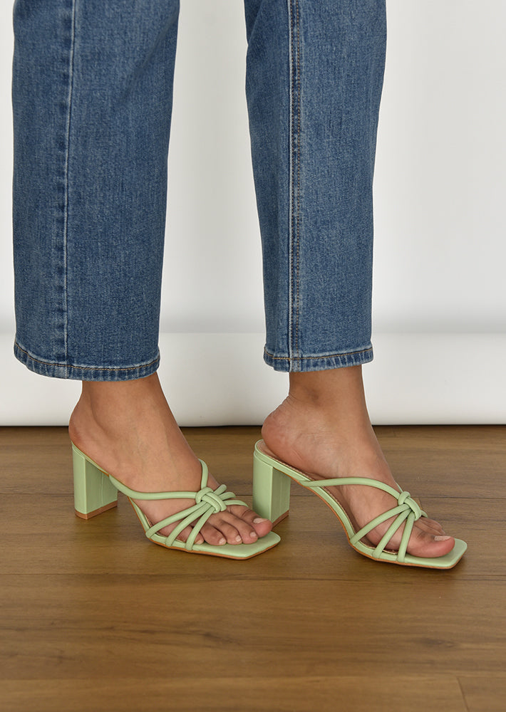 Heeled mules in green