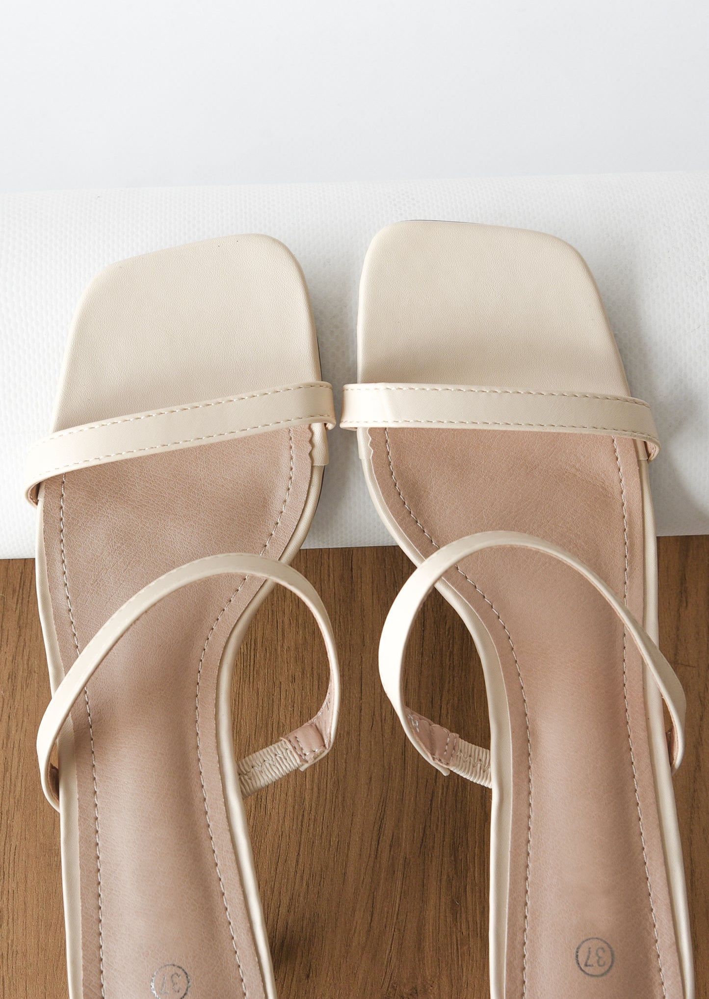 Strappy heeled mules in beige