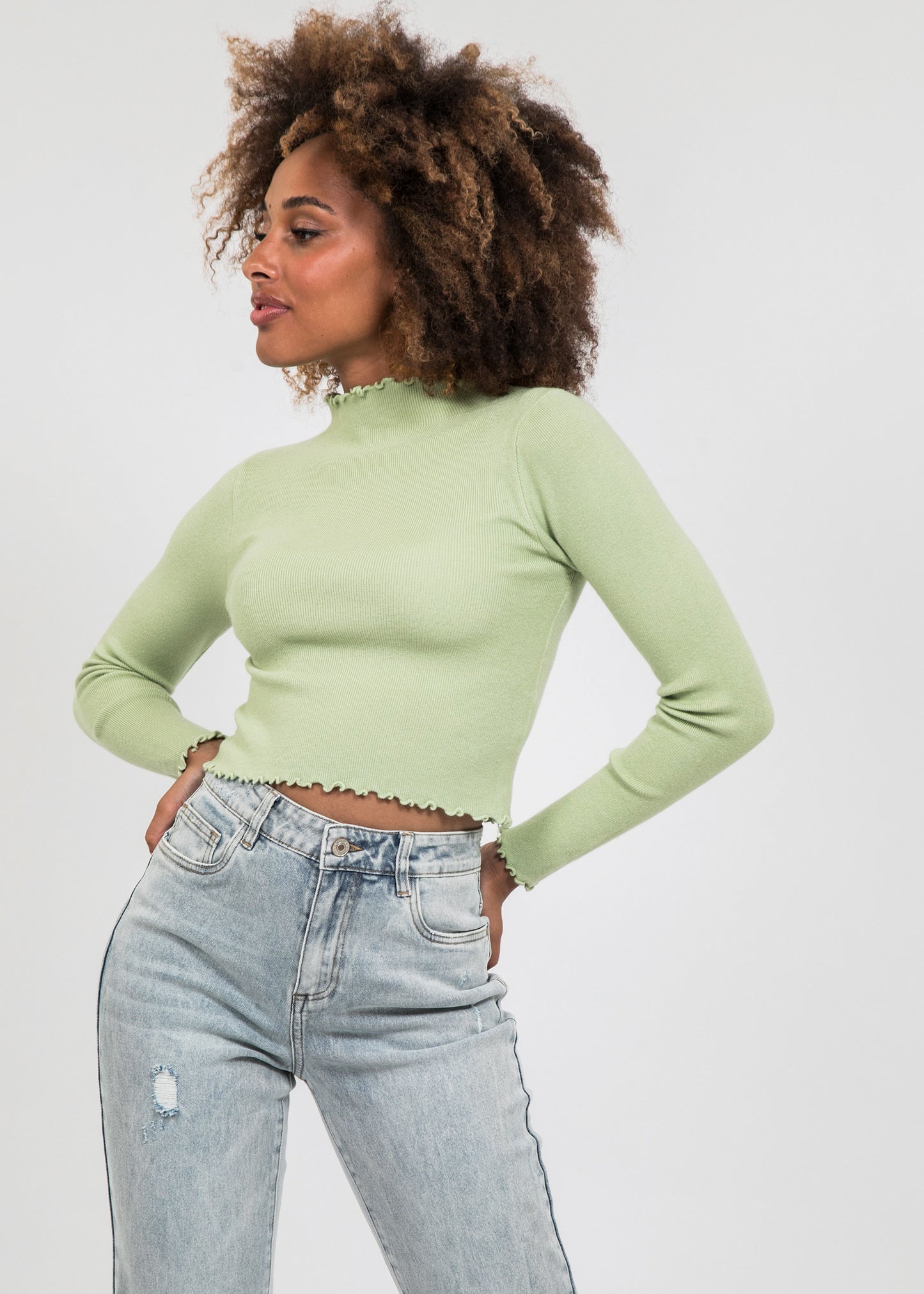 High neck jumper with ruffle hem in green