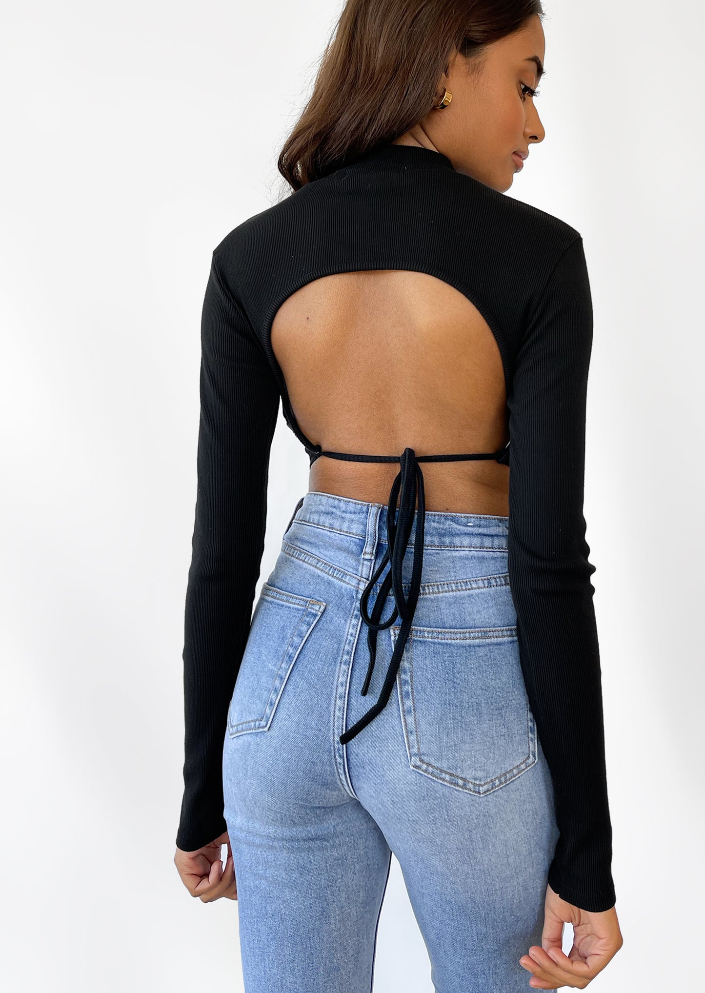 Open back long sleeve top with scarf hem in black